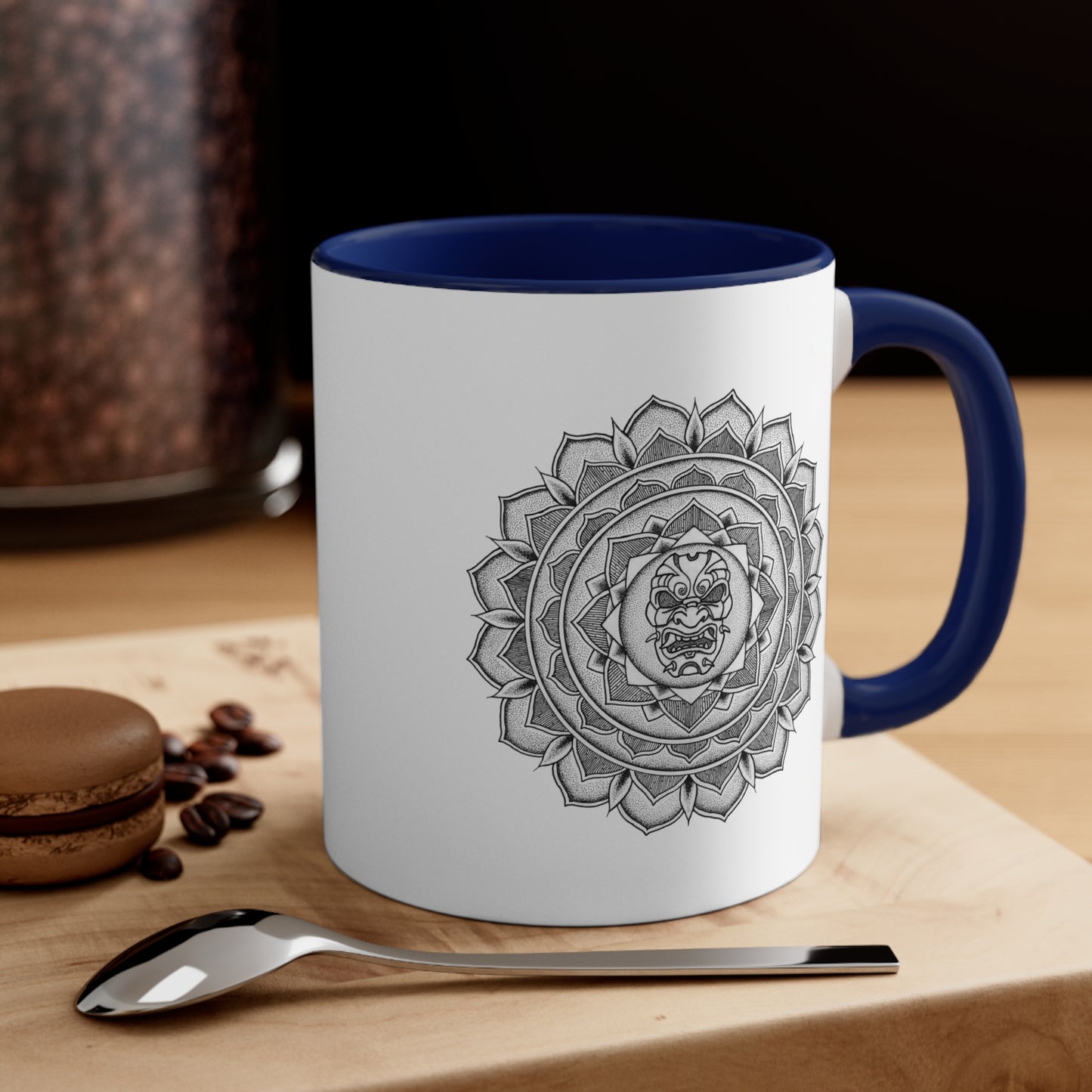 a two toned white and navy blue 11oz coffee mug on a table with a samurai mask mandala design