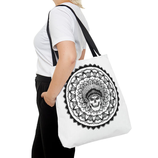 image of a woman holding a white mandalarian brand tote bag with black handle and black and white chieftain skull tattoo mandala design print on both sides