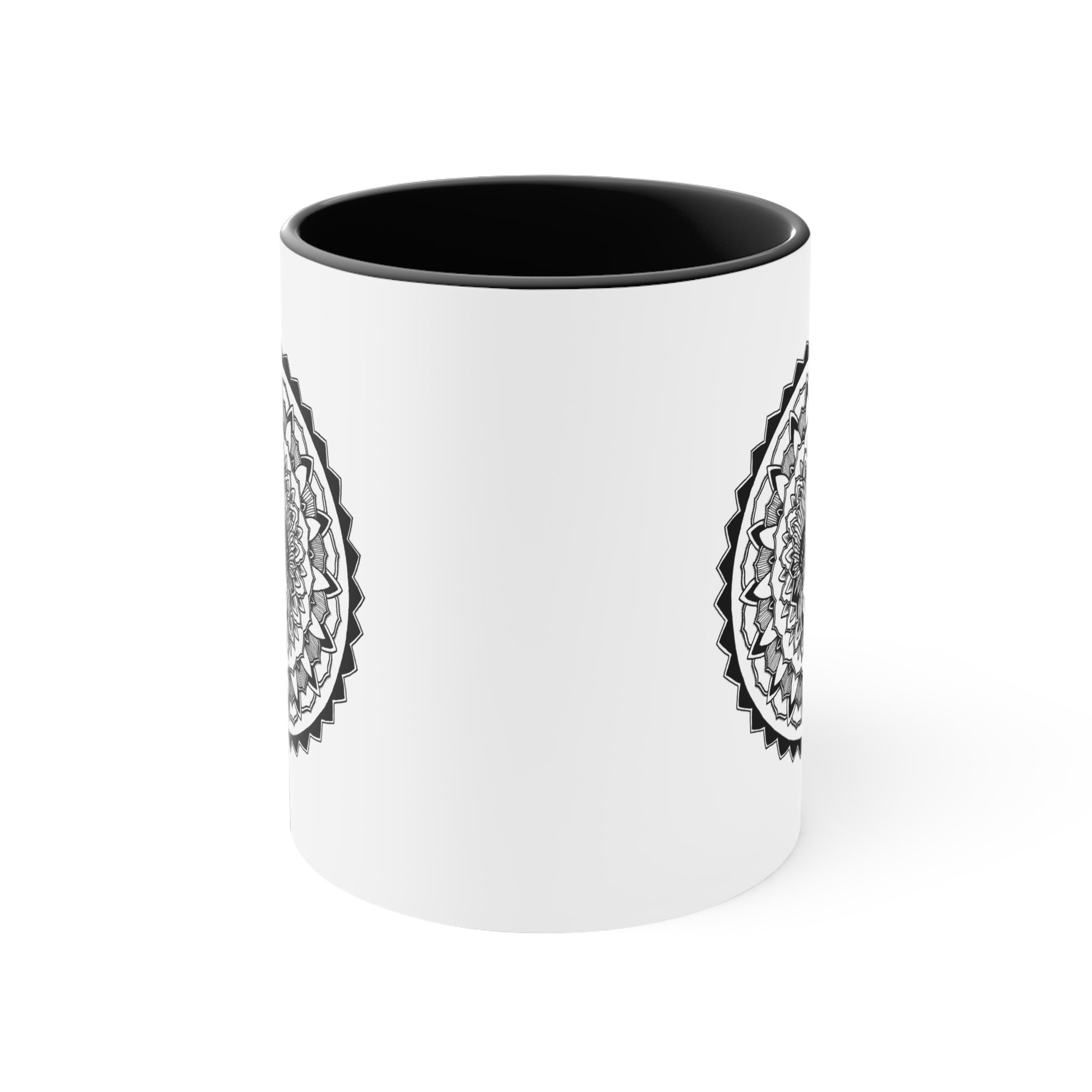 side view of a two toned black and white 11oz coffee mug on a table with chieftain skull mandala design