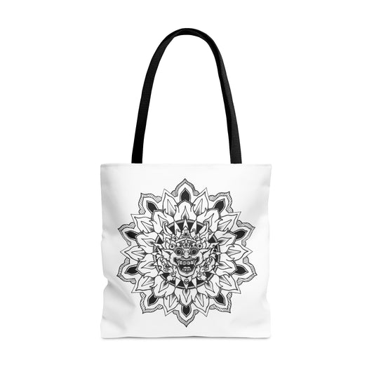 image of a white mandalarian brand tote bag with black handle and black and white bhoma bali god mandala design print on both sides