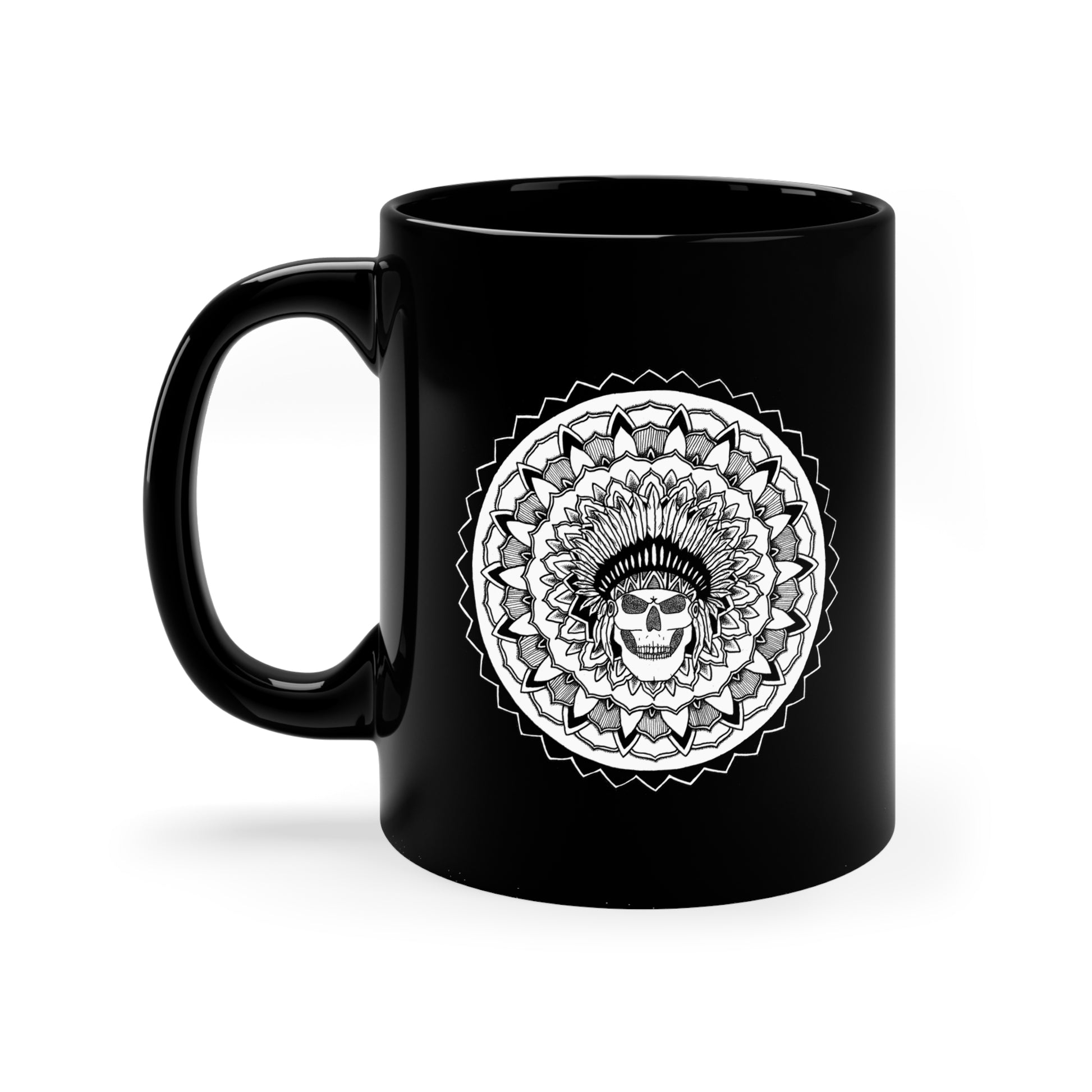 a black 11oz coffee mug with white chieftain skull mandala design